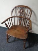 A 19th century elm and beech elbow chair