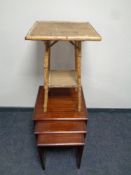 A reproduction nest of tables and a bamboo occasional table