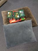 Forty two cans of Co-op and Chappie dog food together with two oversized pet cushions.