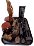 A tray of carved African figures, pair of drum tables,