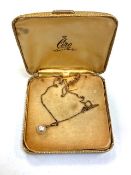 A Ciro pearl pendant on yellow metal chain with 9ct gold push clasp