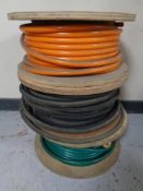 Three reels of hose pipes and shaker hose