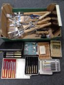 A box of BBQ accessories,