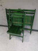 A set of four folding kitchen chairs