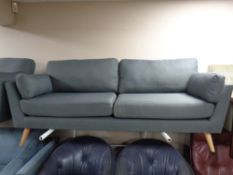 A contemporary Scandinavian three seater settee and matching two seater settee in grey fabric