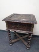 A 19th century carved oak bible box on barley twist legs (locked)