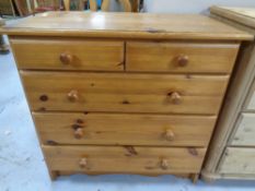A pine five drawer chest