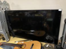 A Samsung 48 inch LCD smart TV with lead and remotes