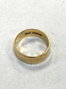 An 18ct yellow gold band ring, 3.8g.
