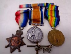 Three WWI medals on ribbons awarded to Gunner F.
