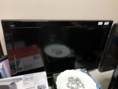 A Panasonic Vierra 32 inch LCD TV with lead and instructions
