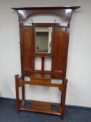 An inlaid mahogany Arts Nouveau mirrored hall stand