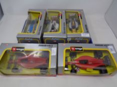Five Burago 1:24 scale die cast racing cars - two Ferrari 64/2, Formula 3000 Pacific Grand Prix,