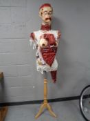 A house of horrors dummy on mannequin stand