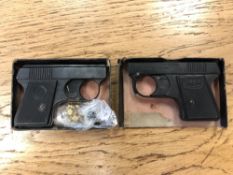 A Webley Sports Starting Pistol, together with another similar starting pistol and a bag of caps.