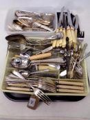 A tray of stainless steel and silver plated cutlery