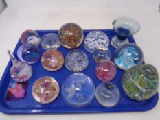 A tray of sixteen assorted glass paperweights including Royal Doulton,