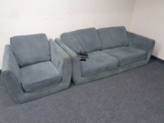 A contemporary two seater settee with armchair in dark grey fabric