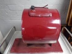 A metal tombola drum on stand