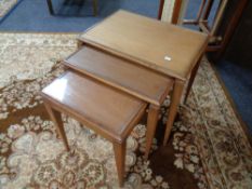 A nest of mid century teak tables