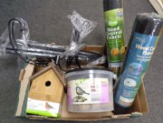 A box of metal bird feeding stand, bird house, box of fat balls,
