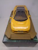 A Maisto 1:12 scale Jaguar XJ220 1992 Concept Police Car on plinth,