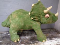 A Hasbro Playskool ride on dinosaur