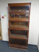 A Globe Wernicke oak five tier stacking bookcase, width 86.5 cm.