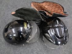 A box of pair of Cambrelle leather motorcycle boots together with two further motorcycle helmets