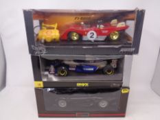 Three 1:18 scale die cast cars - Hot Wheels Racing F1 - 2000 Michael Schumacher,