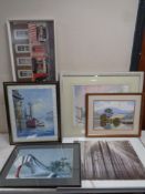 A floral patterned rug on brown ground together with a quantity of pictures, wall canvases,