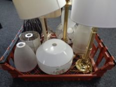 A crate of modern table lamps and light shades