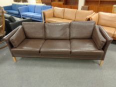A Danish Mobler three seater settee in brown leather
