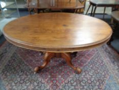 A Victorian mahogany oval pedestal breakfast table