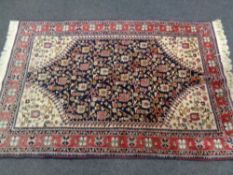 A fringed Persian rug, probably Kashan, Central Iran,