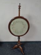 A 19th century rosewood and beech pole screen