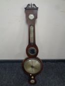 A George III banjo barometer with silvered dial