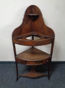 A George III mahogany corner wash stand