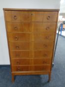 A mid century Scandinavian walnut seven drawer chest