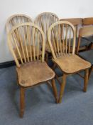 A set of four oak spindle back dining chairs