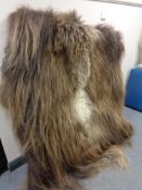 A shaggy pile rug mounted on a wooden frame