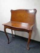 A 19th century mahogany turn over top tea table
