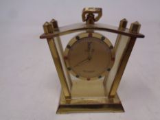 A miniature Muster Geschutzt Antimagnetic brass cased German desk clock, height 5 cm.
