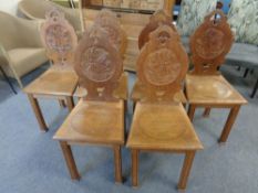 A set of six 20th century carved oak dining chairs