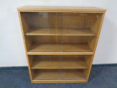 A mid century sliding glass door bookcase