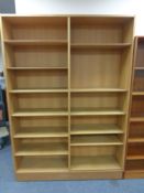 A set of 20th century open bookshelves in an oak finish