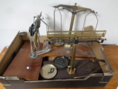 A box of three antique sets of scales