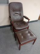 A Danish stained beech chair with brown leather upholstery with stool