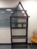 A set of early 20th century painted pine bookshelves together with a corner wall shelf