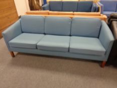 A Danish 20th century three seater settee in blue fabric